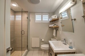 Shower, hair dryer, towels, shampoo