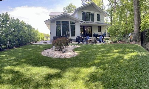 Custom 4-bedroom home, boat slip, fenced backyard, pool & paved bike path.