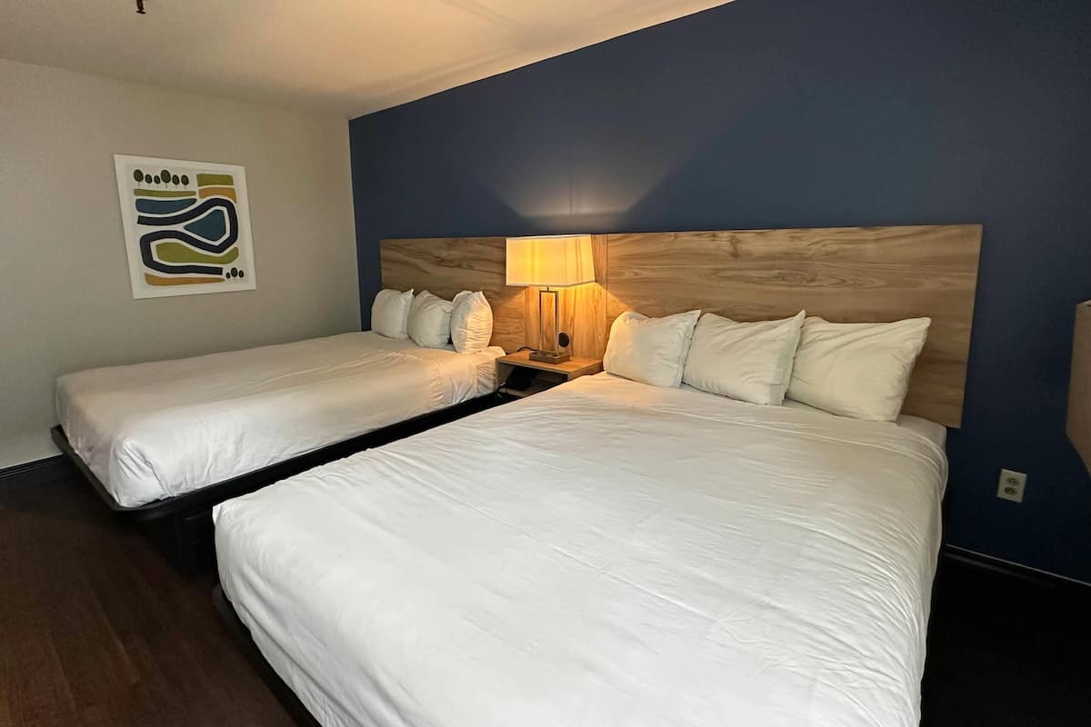 Standard Room, 2 Queen Beds, Non Smoking | Premium bedding, down comforters, blackout drapes, iron/ironing board
