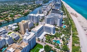 A coastal cityscape with high-rise buildings, a river, and a beach. - YOUR VACATION HOME! NEAR THE BEACH (Miami)