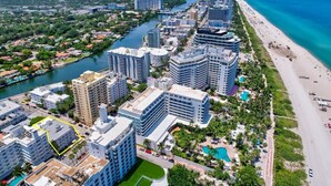 A coastal hotel with multiple high-rise buildings, a marina, and a beach. - 2 BEDROOM ON THE BEACH ! (Miami)