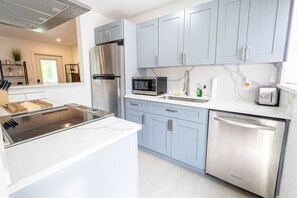 Fridge, coffee/tea maker, cookware/dishes/utensils