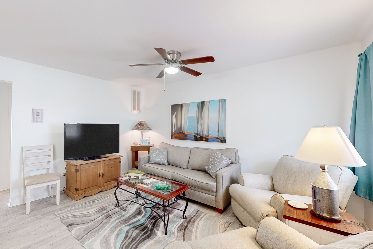 Beachside dog-friendly condo with furnished deck & walkable location