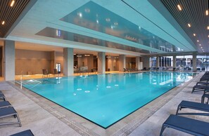 Indoor pool, seasonal outdoor pool, pool umbrellas, pool loungers