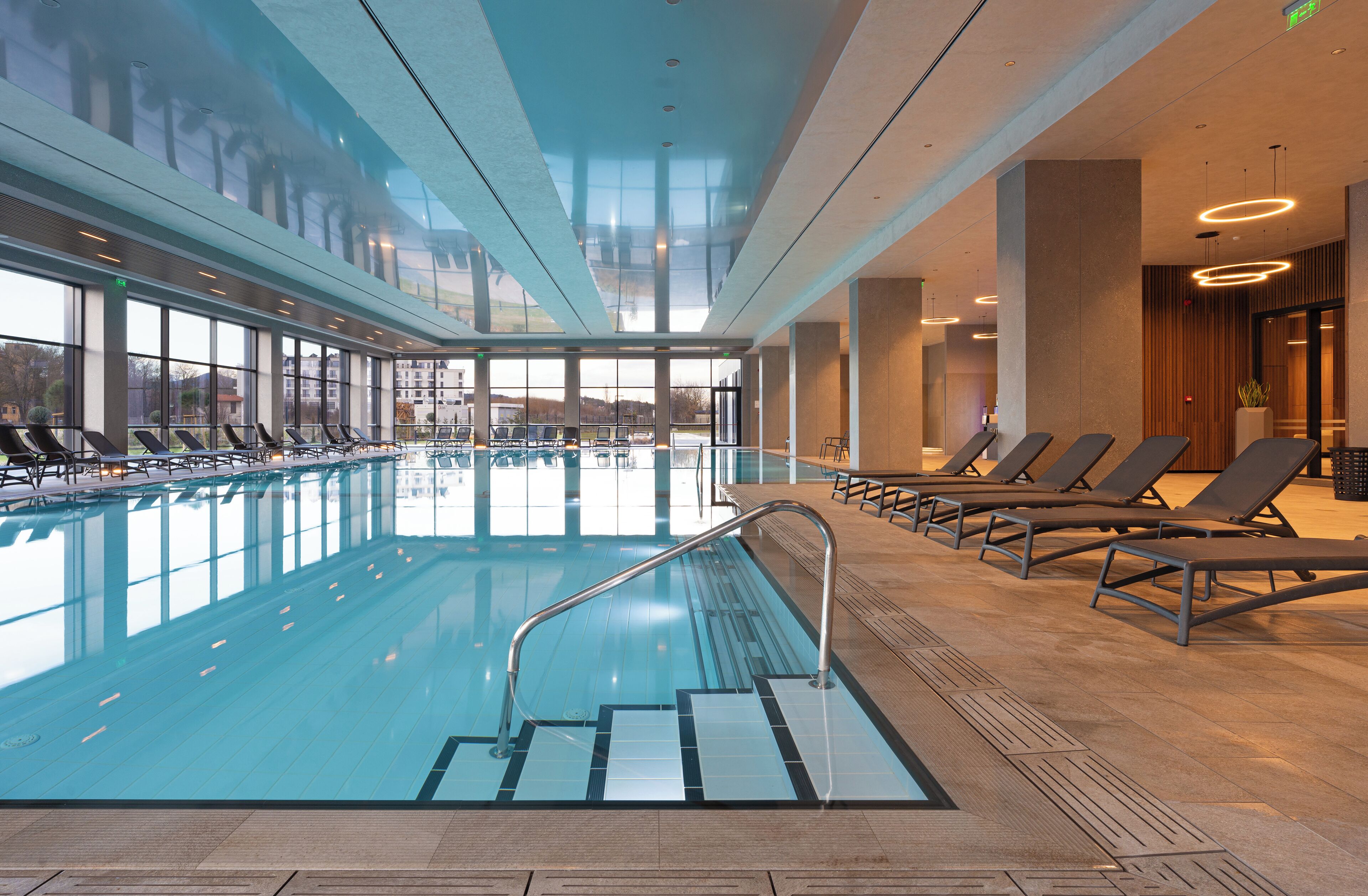 Indoor pool, seasonal outdoor pool, pool umbrellas, sun loungers