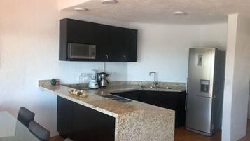Fridge, microwave, stovetop, coffee/tea maker