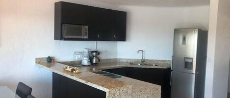 Fridge, microwave, stovetop, coffee/tea maker