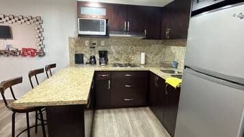 Fridge, microwave, stovetop, coffee/tea maker