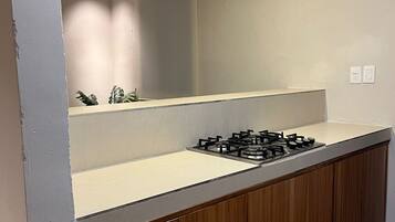 Fridge, microwave, stovetop, coffee/tea maker