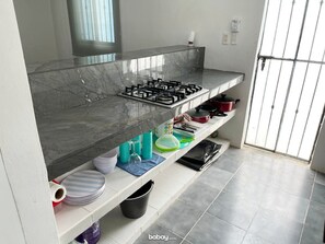 Fridge, microwave, stovetop, coffee/tea maker
