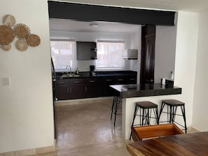 Fridge, microwave, stovetop, coffee/tea maker