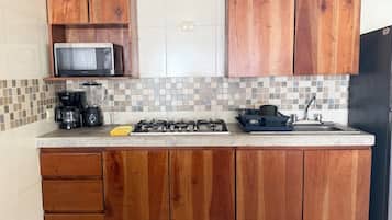 Fridge, microwave, stovetop, cookware/dishes/utensils