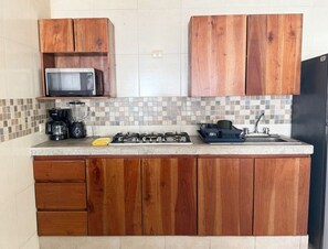 Fridge, microwave, stovetop, cookware/dishes/utensils