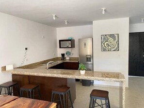 Fridge, microwave, stovetop, coffee/tea maker