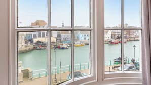 A bay with boats and a pier. - 5 bedroom accommodation in Weymouth (Weymouth)