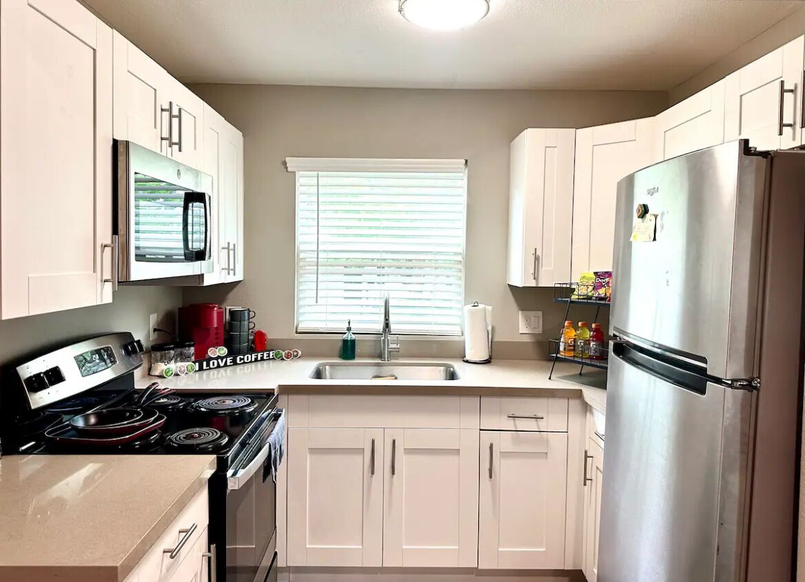 Fridge, microwave, coffee/tea maker, cookware/dishes/utensils