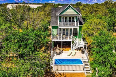 Waterfront home with game room, decks, pool, smart TVs, kayaks, & gas grill