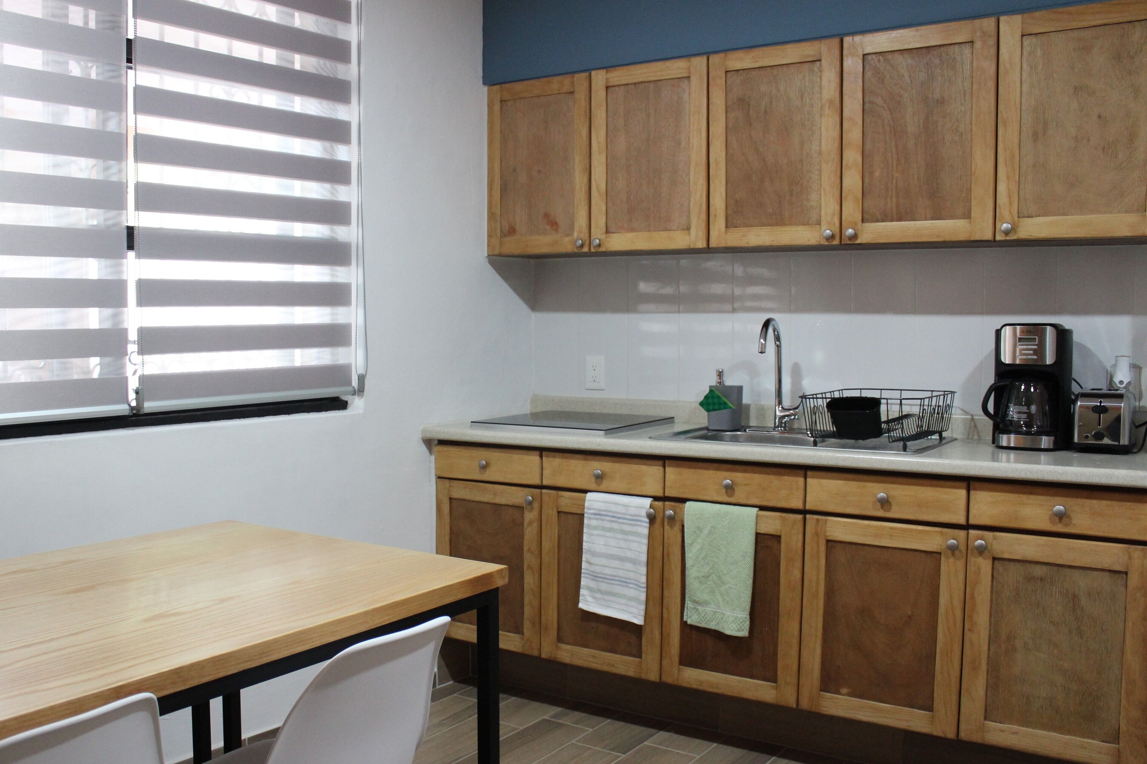 Family Apartment, Courtyard View | Private kitchen | Microwave, stovetop, coffee/tea maker, toaster