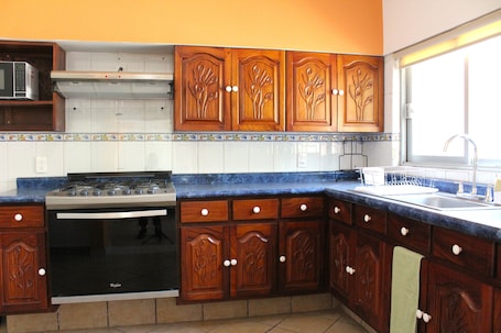 Family House, Patio, Courtyard View | Private kitchen | Microwave, stovetop, coffee/tea maker, toaster