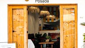 A wooden storefront with the sign "Corazón de Teco" and "Posada" indicating a bed and breakfast. - Corazon de Teco (Tecolutla)