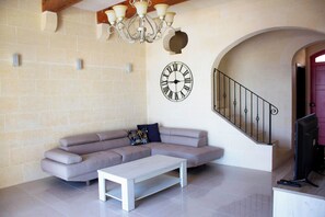 Family Townhome, Multiple Bedrooms (Kenn Gozitan villa and pool) | Living area | 21-inch Smart TV with satellite channels - Kenn Gozitan Villa and Pool (Gharb)