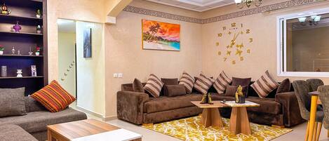 Deluxe Apartment | Living area | 55-inch Smart TV with digital channels, Netflix, streaming services