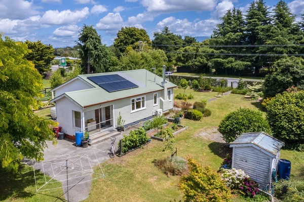 Solar powered home in rural setting, close to amenities.