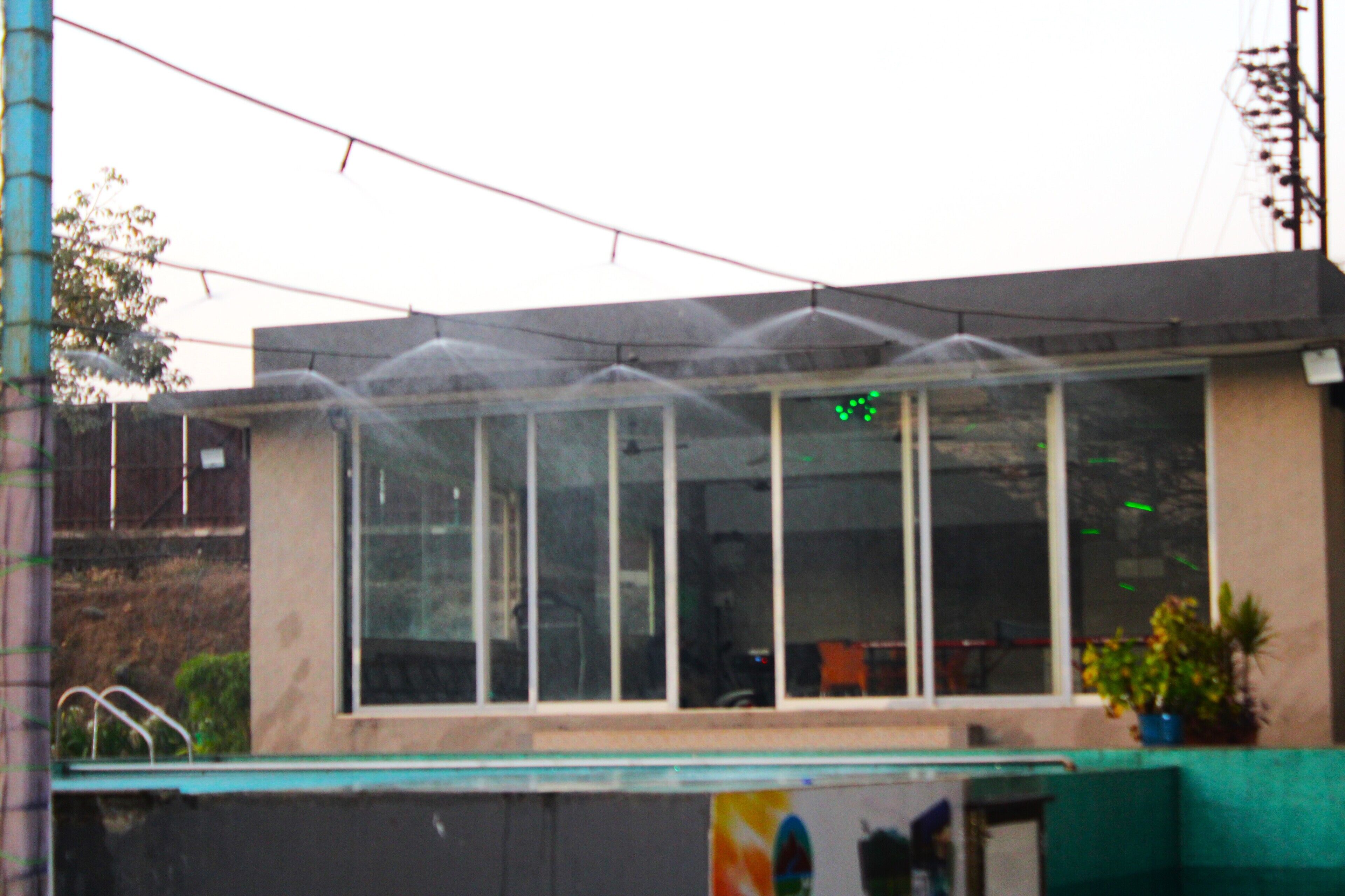 A building with large windows and a green roof.
