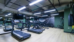 A gym with treadmills, exercise equipment, and a large mirror. - w* | Marvelous 2BR with balcony in Miraflores (Lima)