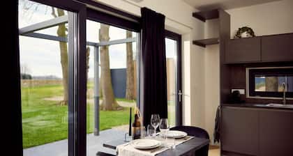 The luxurious two-person hotel studio with a beautiful patio, high windows and sliding doors offers a surprising amount of privacy, space and comfort.