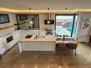 Villa | Private kitchen | Coffee/tea maker, electric kettle, toaster, high chair