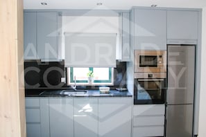 Fridge, microwave, oven, stovetop -  A small one bedroom apartment near Douro river in the heart of Pinhão. (Pinhão)