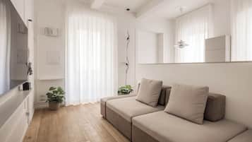 Design Apartment | Living area | 40-inch flat-screen TV with digital channels