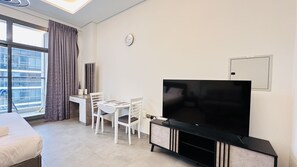 Minibar, desk, laptop workspace, iron/ironing board