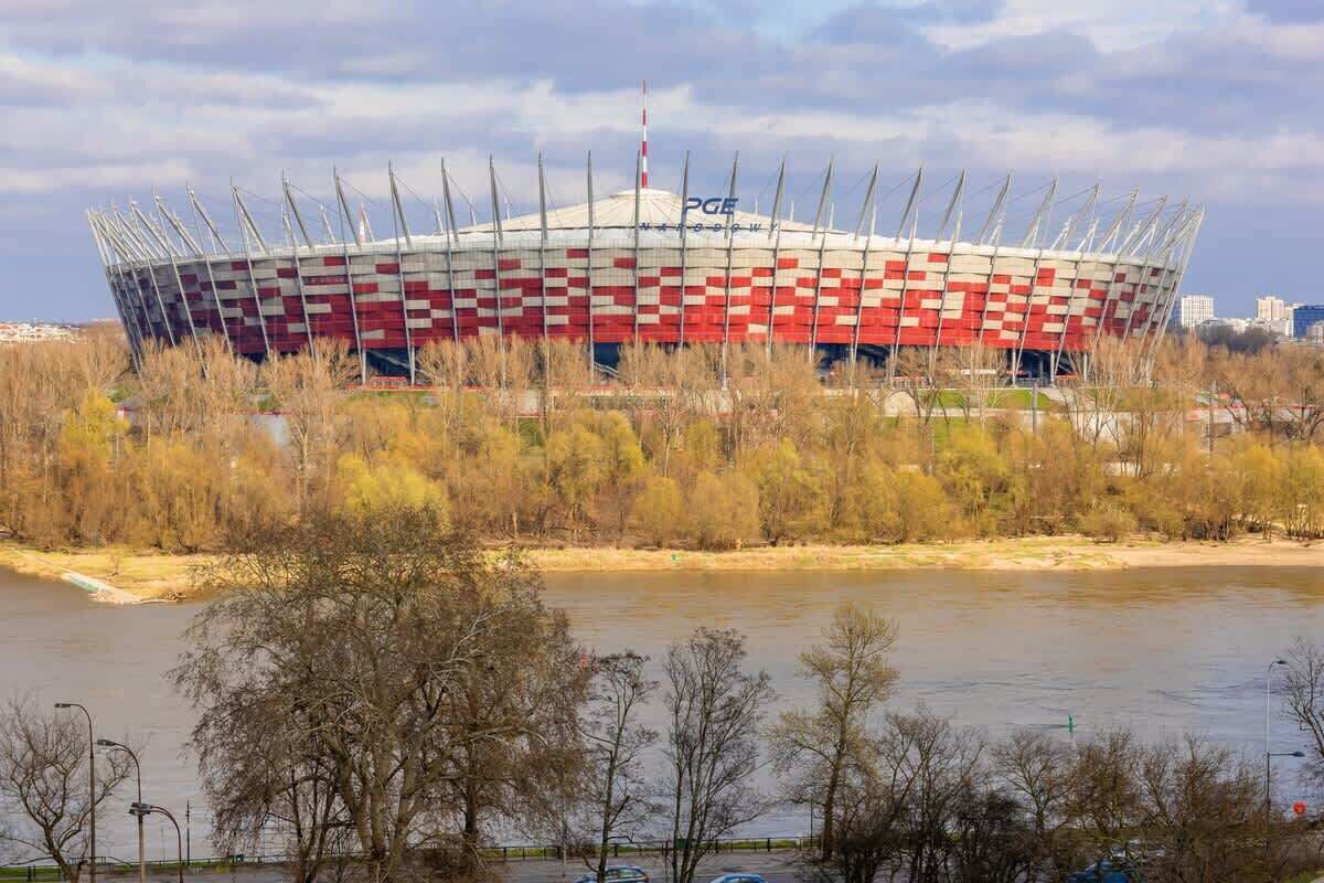 A stadium with a distinctive checkered pattern and a flagpole on top.
