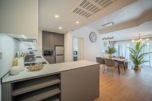 Executive Apartment, 1 Bedroom, Terrace, Pool View | Private kitchen | Full-sized fridge, microwave, stovetop, coffee/tea maker - Allamanda Residences by NLA (Choeng Thale)