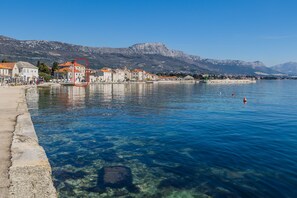 Stunning coastal views of the sea and surrounding mountains.