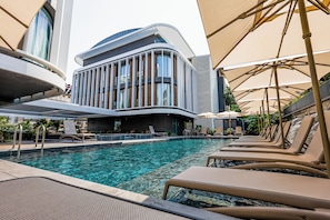 Outdoor pool, open 8:00 AM to 8:00 PM, pool umbrellas, pool loungers