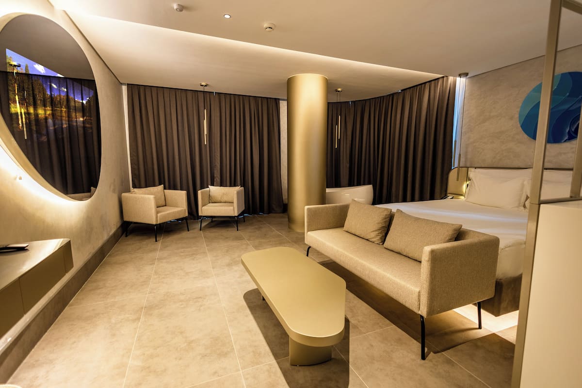 Honeymoon Room, 1 King Bed, Partial Sea View | Minibar, in-room safe, individually decorated, individually furnished
