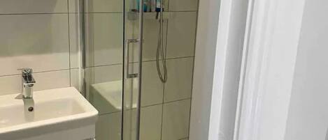 Shower, towels, soap, toilet paper