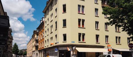 A multi-story building with a restaurant on the ground floor.