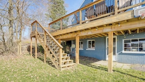 A two-story wooden deck with a staircase leading to a balcony. - Delton Lake House w/ Boat Dock: Fish, Swim & More! (Delton)