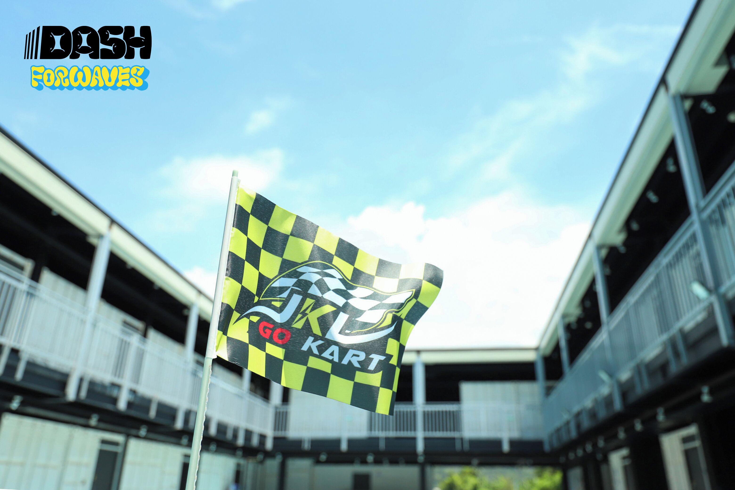 A building with a checkered flag and a logo that reads "GO KART".