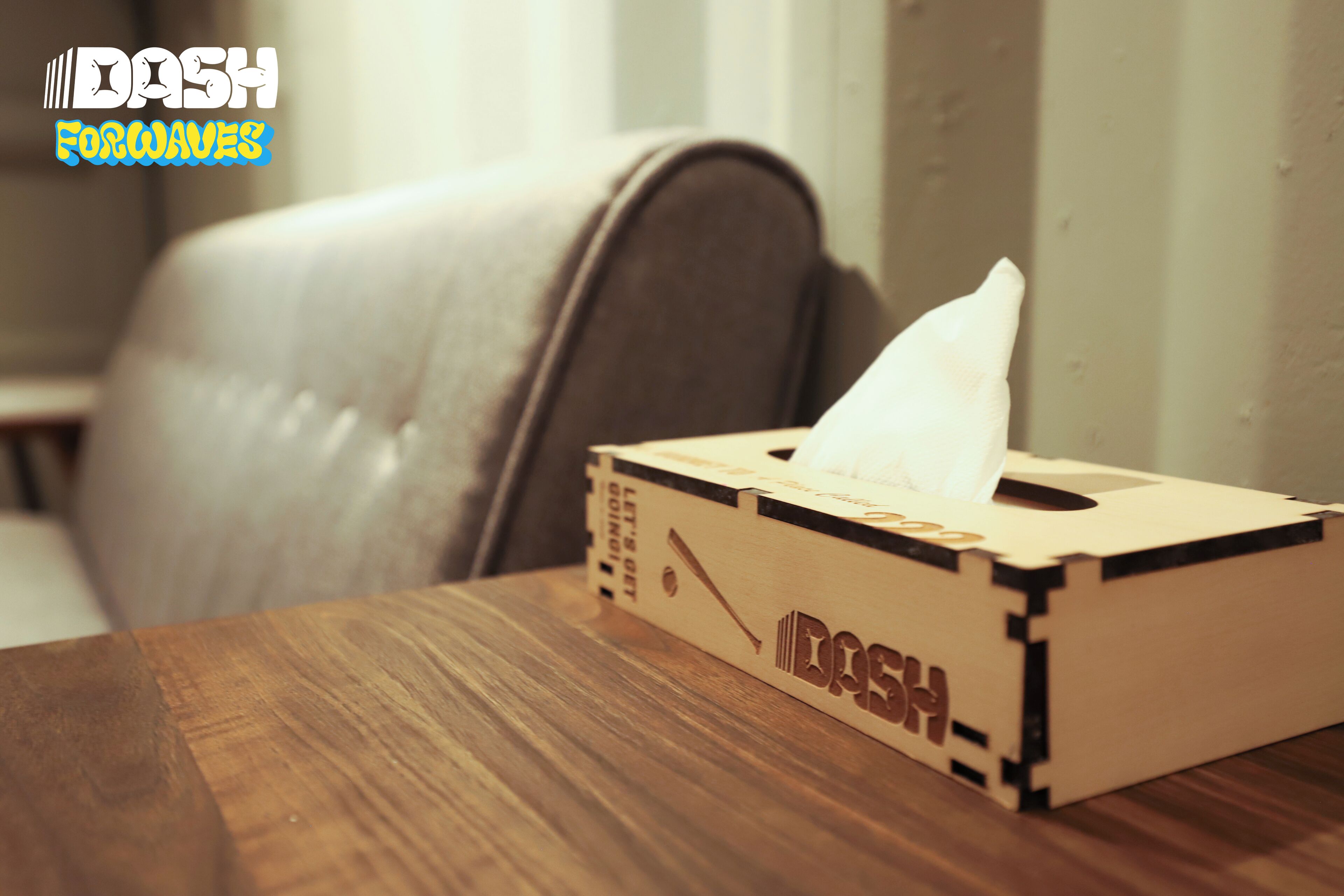 A tissue box on a wooden table.