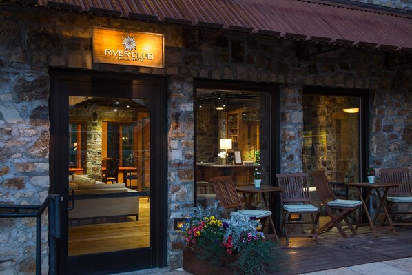 River Club's inviting entrance welcomes guests to a cozy atmosphere.