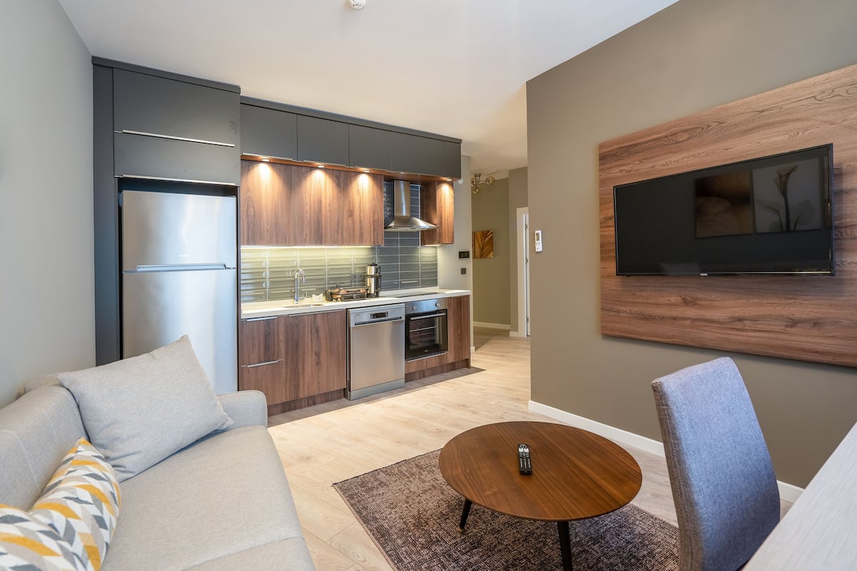Family Suite | Living room | 50-inch Smart TV with satellite channels, Netflix, streaming services