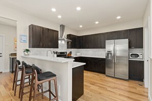 Fridge, microwave, oven, stovetop - Contemporary Gem - Rooftop Deck & Private Hot Tub! (Fort Collins)