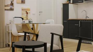 Appartamento, 1 camera da letto, patio | Area soggiorno