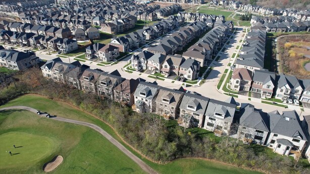 An aerial view of a residential area with modern houses, a golf course, and well-maintained roads. - Serene High-celling Retreat in Upsacle and Safe Neighbourhood (Oakville)