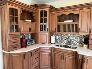 Fridge, microwave, stovetop, coffee/tea maker